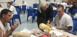Stitching smiles at Kyle Correctional