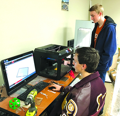 A pair of Dripping Springs students use a Computer-Aided Design (CAD) and a 3-D printer in what has recently been designated as a “Fab Lab.” (courtesy photo)