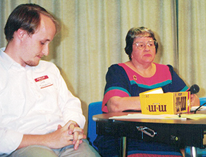 Former Hays Free Press editor Jon Schnautz moderates a debate between Tommy Poer and BSEACD board member Jim Camp. (Hays Free Press file photo)