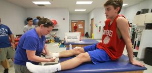 A TALE OF THE TAPE  Athletic trainers aim for safety among athletes