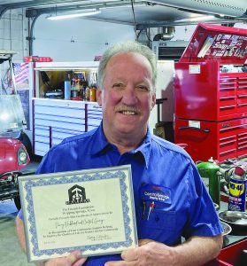 The Friends Foundation presents certificate to Central Garage